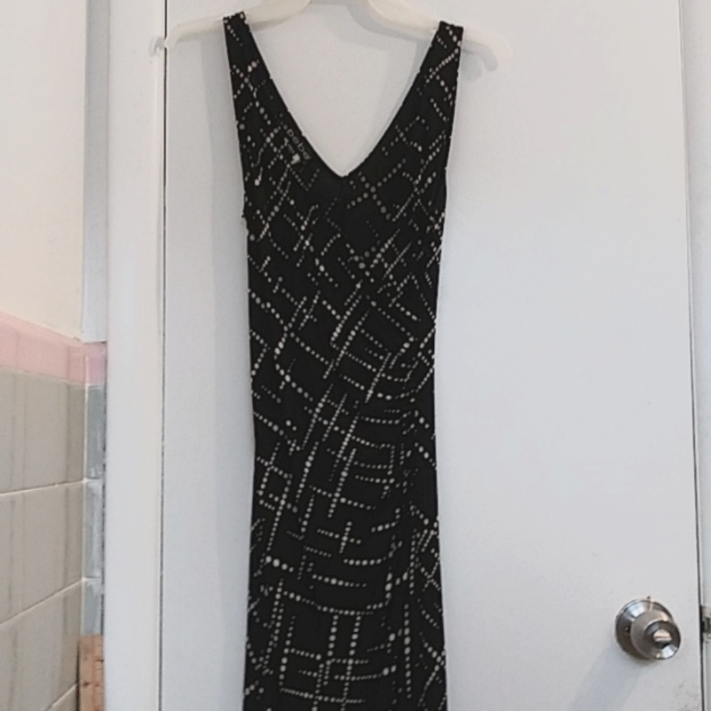 A Beautiful bebe Black with White polka dots dress. Size Small.